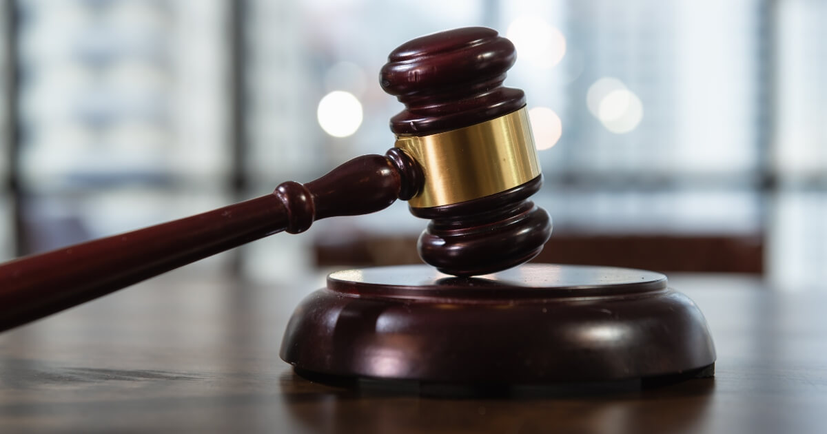 stock image of a gavel resting on the judges bench